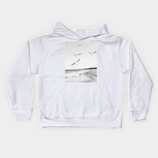 Flock of seagulls flying above the water Kids Hoodie